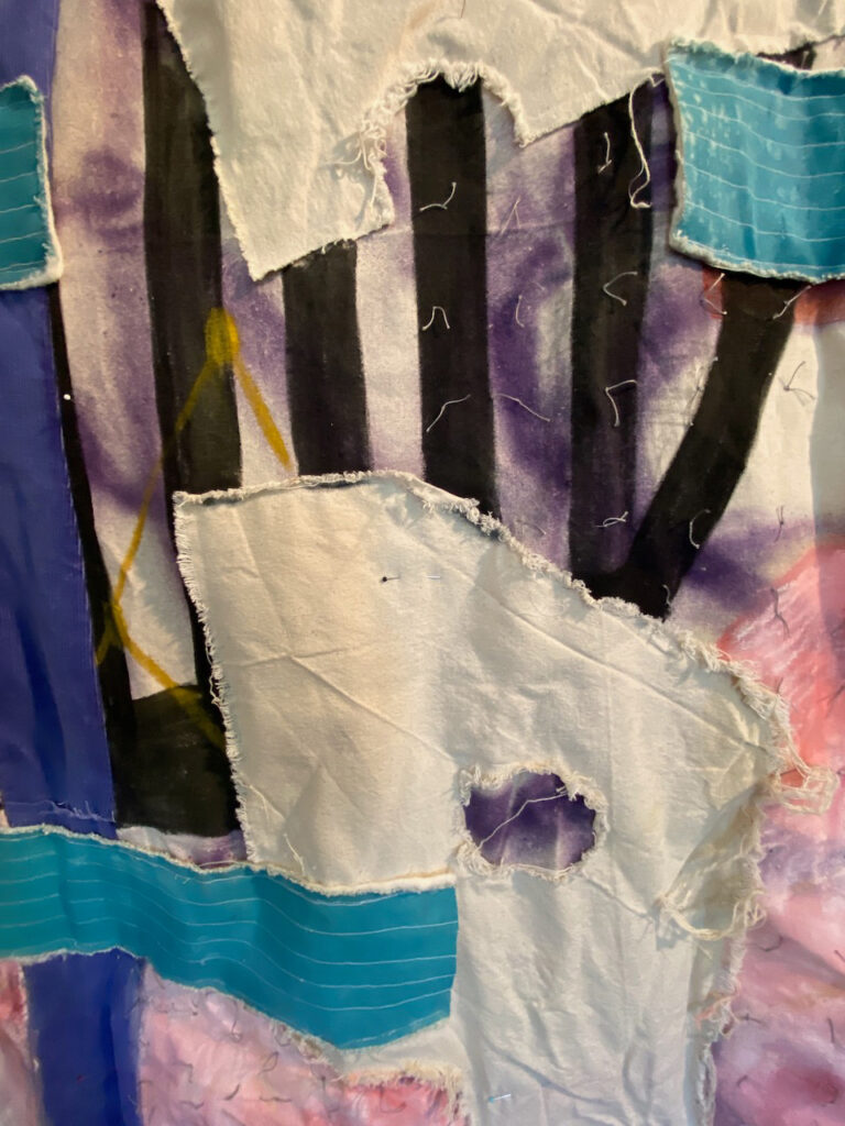A detail image of a mixed media fabric artwork