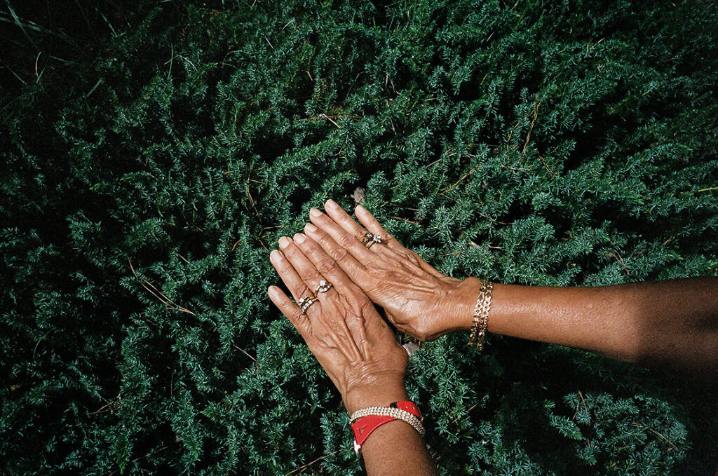 A photograph of someone's hands, displaying the jewelry they are wearing