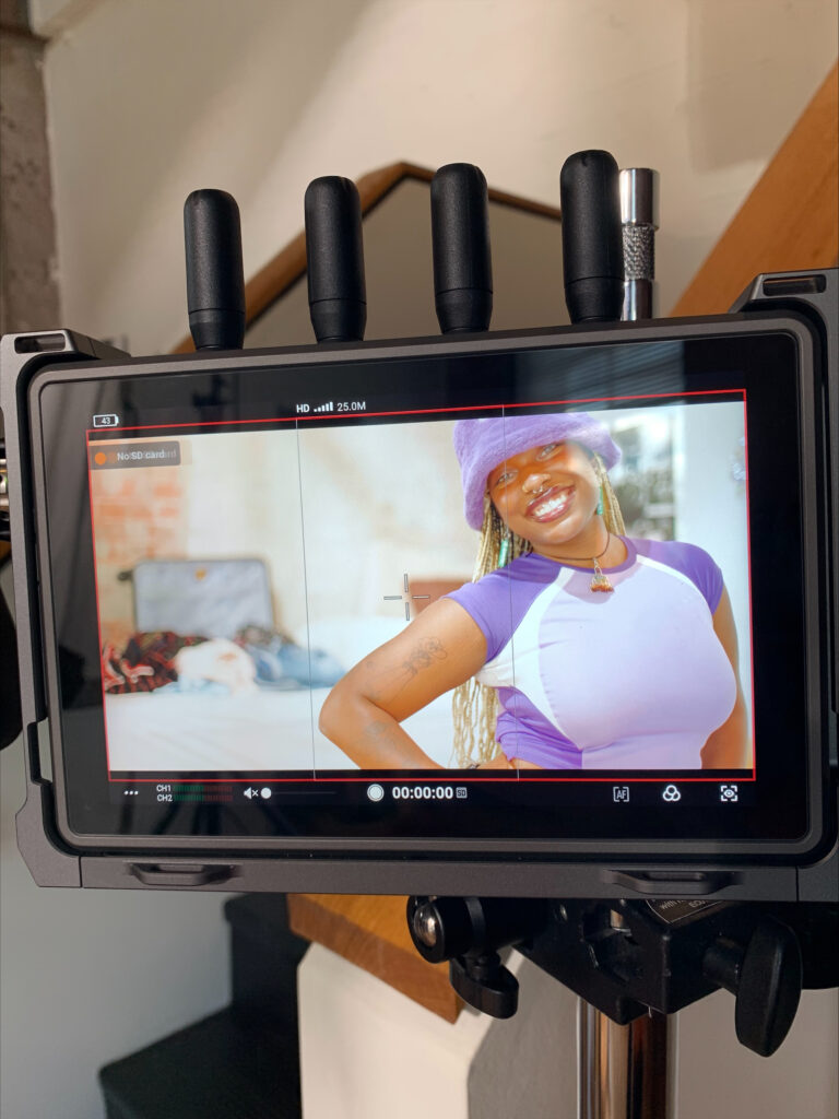 a photo of a student being filmed through a viewfinder